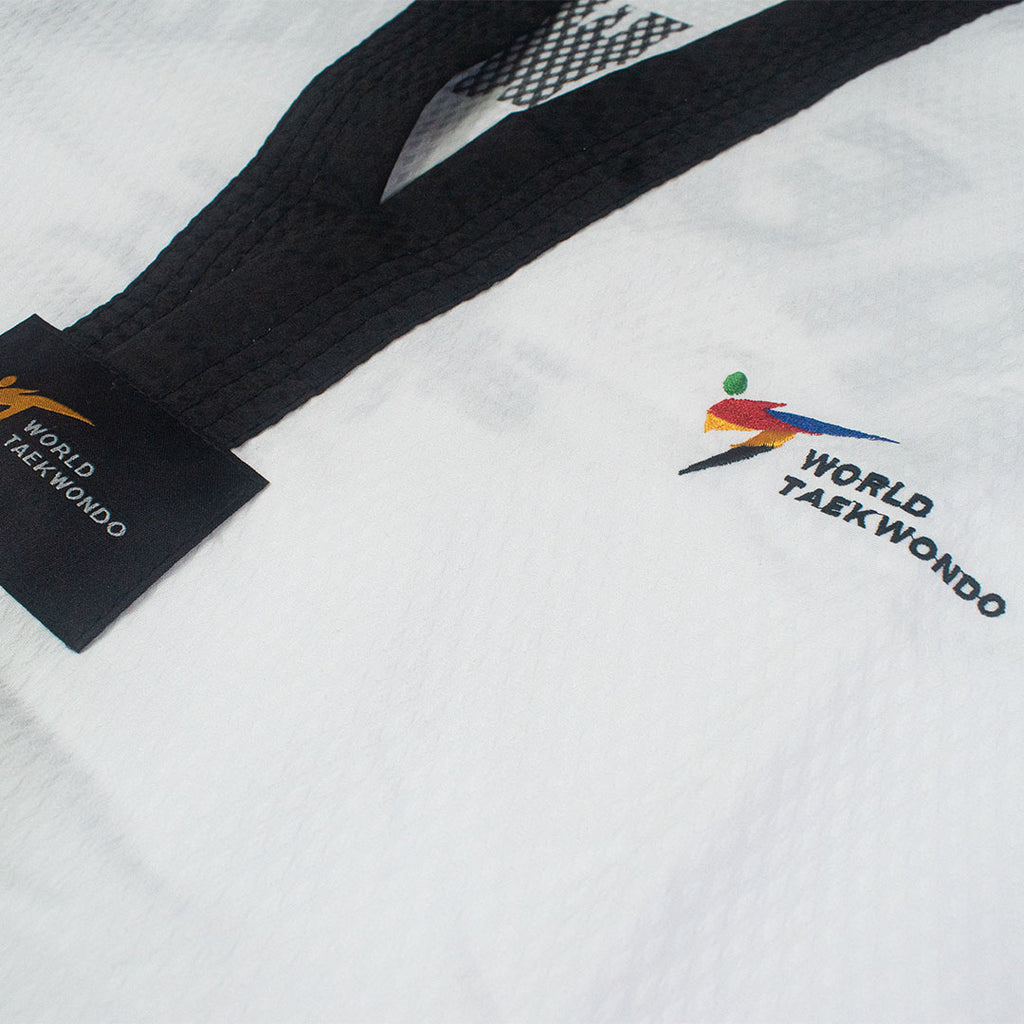 White martial arts uniform with black belt and World Taekwondo logo